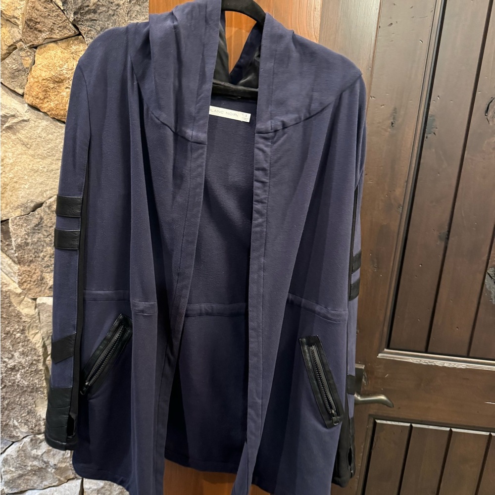 Sweatshirt jacket with faux leather accent.